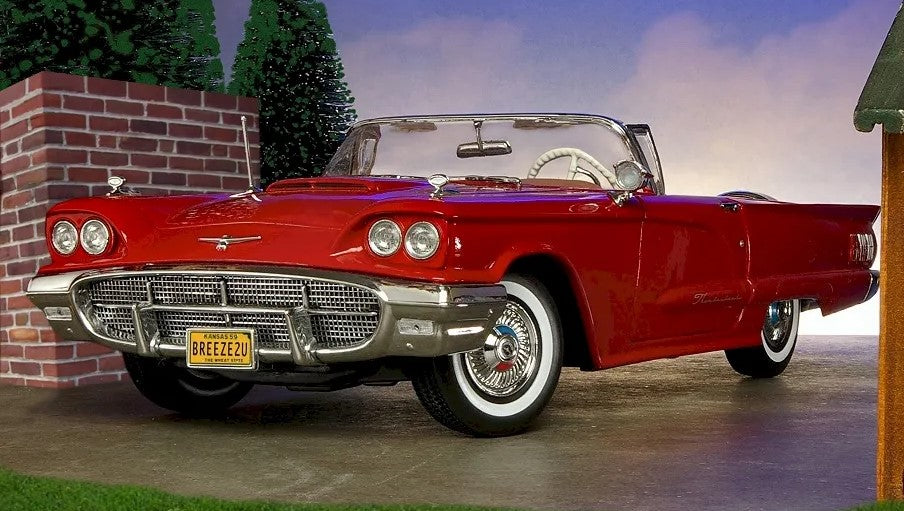 A red classic 1950's Ford Thunderbird convertible diecast scale replica model car