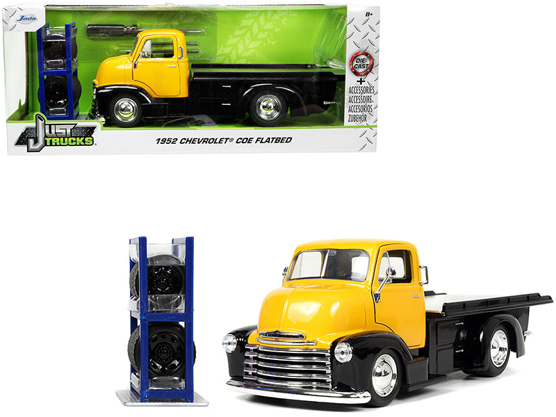 Brand new 1/24 scale diecast car model of 1952 Chevrolet Coe Flatbed Truck Yellow Metallic and Black with Extra Wheels Just Trucks Series di