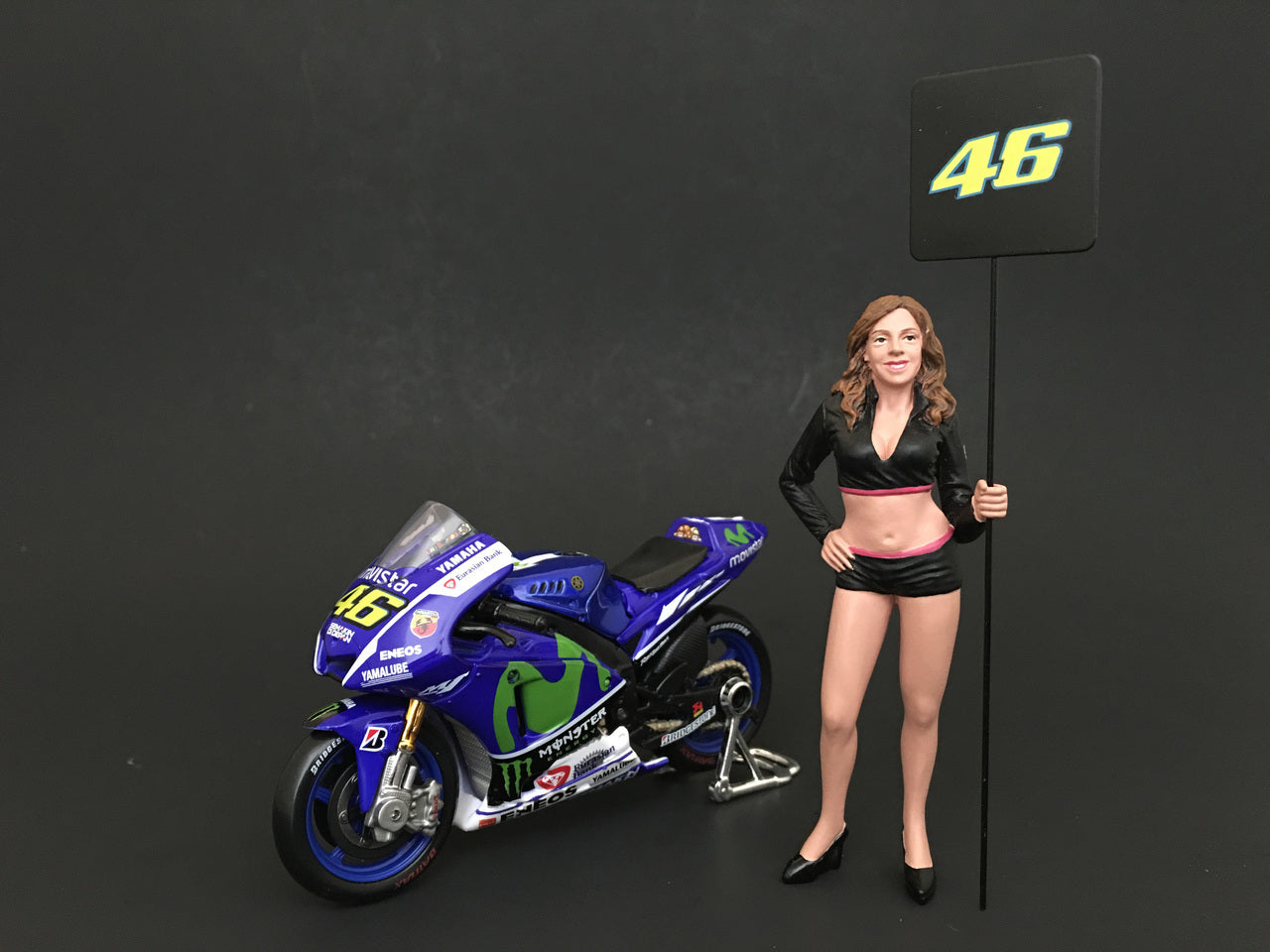Paddock Girl Figure For 1:24 Scale Models by American Diorama.
Comes in a blister pack.
Only one figure with a sign wi