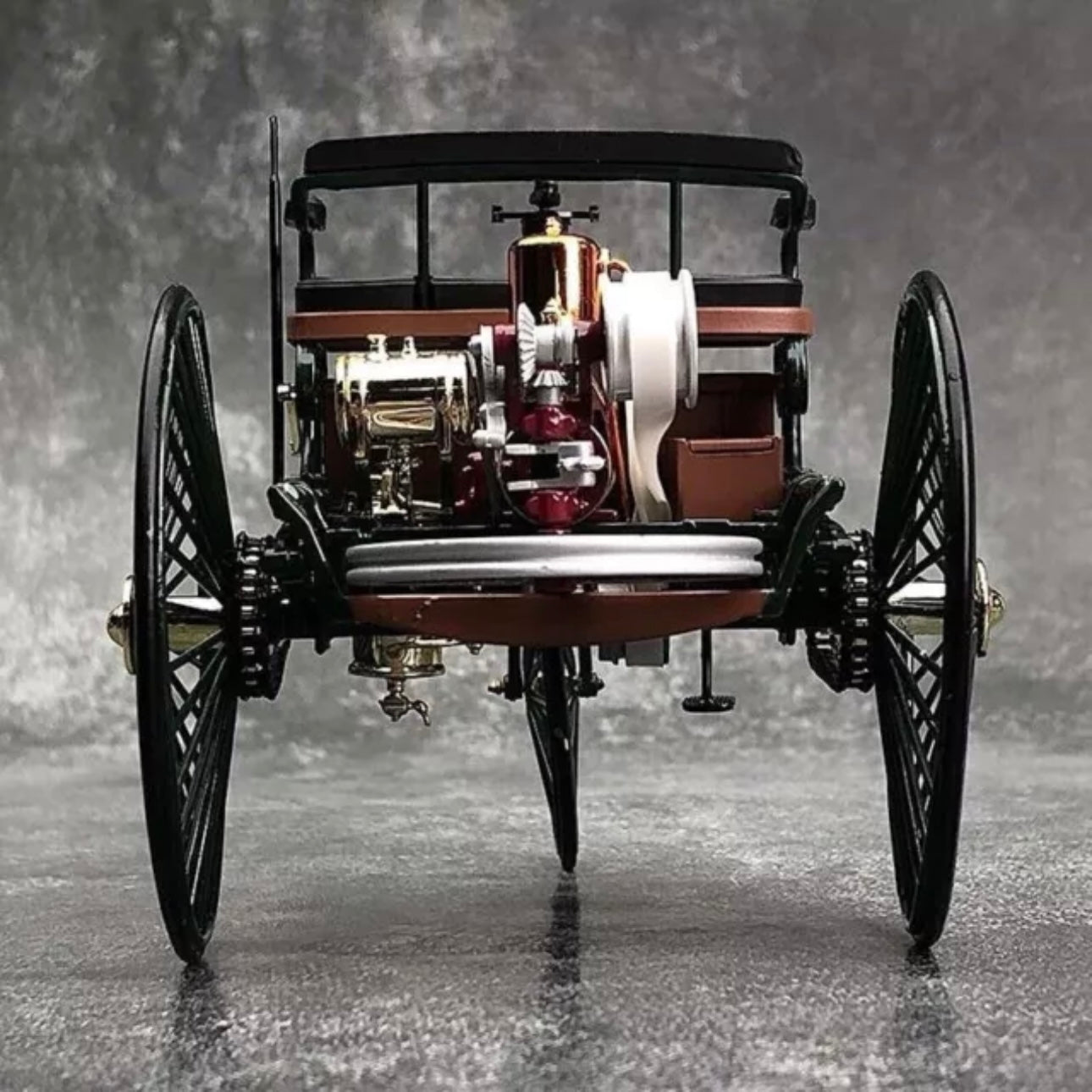 A vintage Mercedes Benz diecast car scale model viewed from the back 