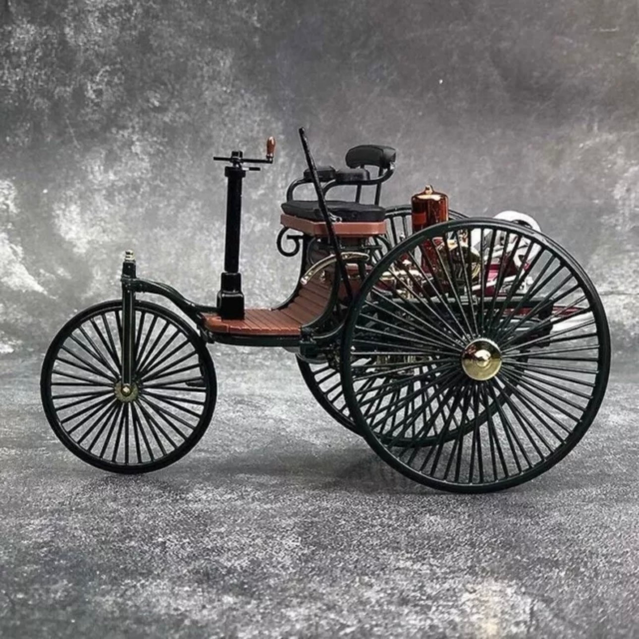 A diecast scale replica model of an 1886 Benz Patent Motorwagen car