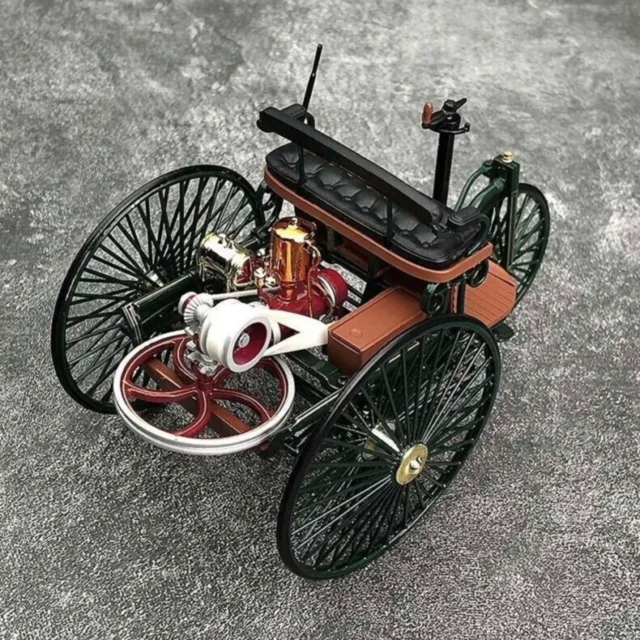 A closeup of the engine in a vintage Mercedes Benz Diecast car