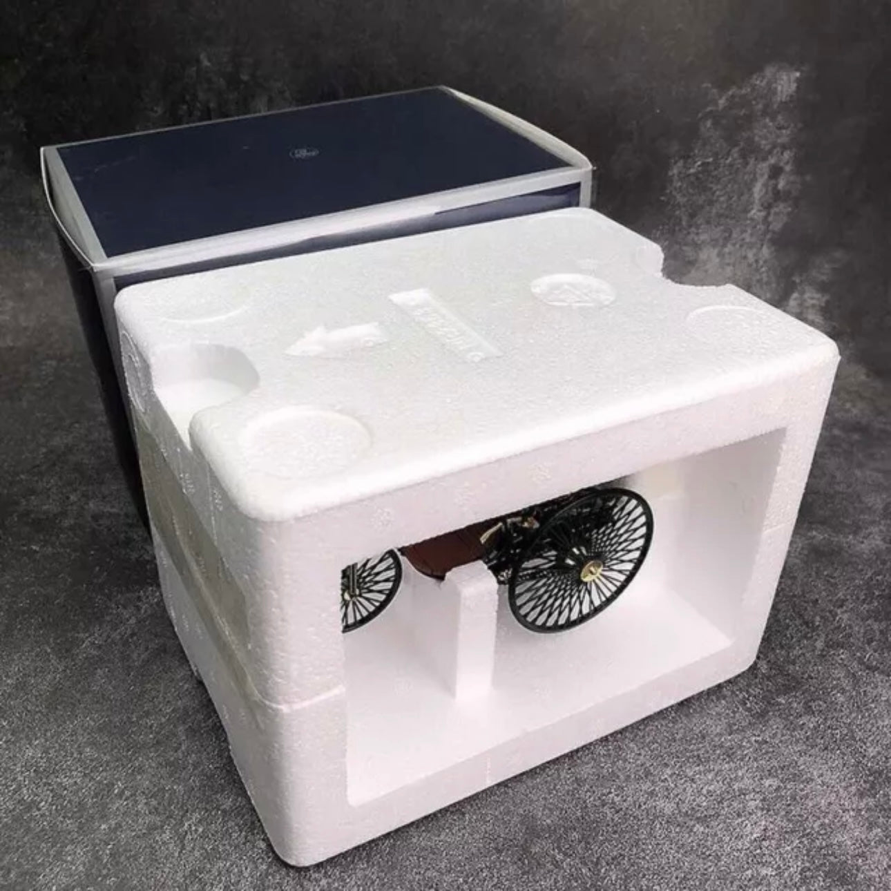 Opening the box of a new vintage Mercedes Benz diecast model car replica