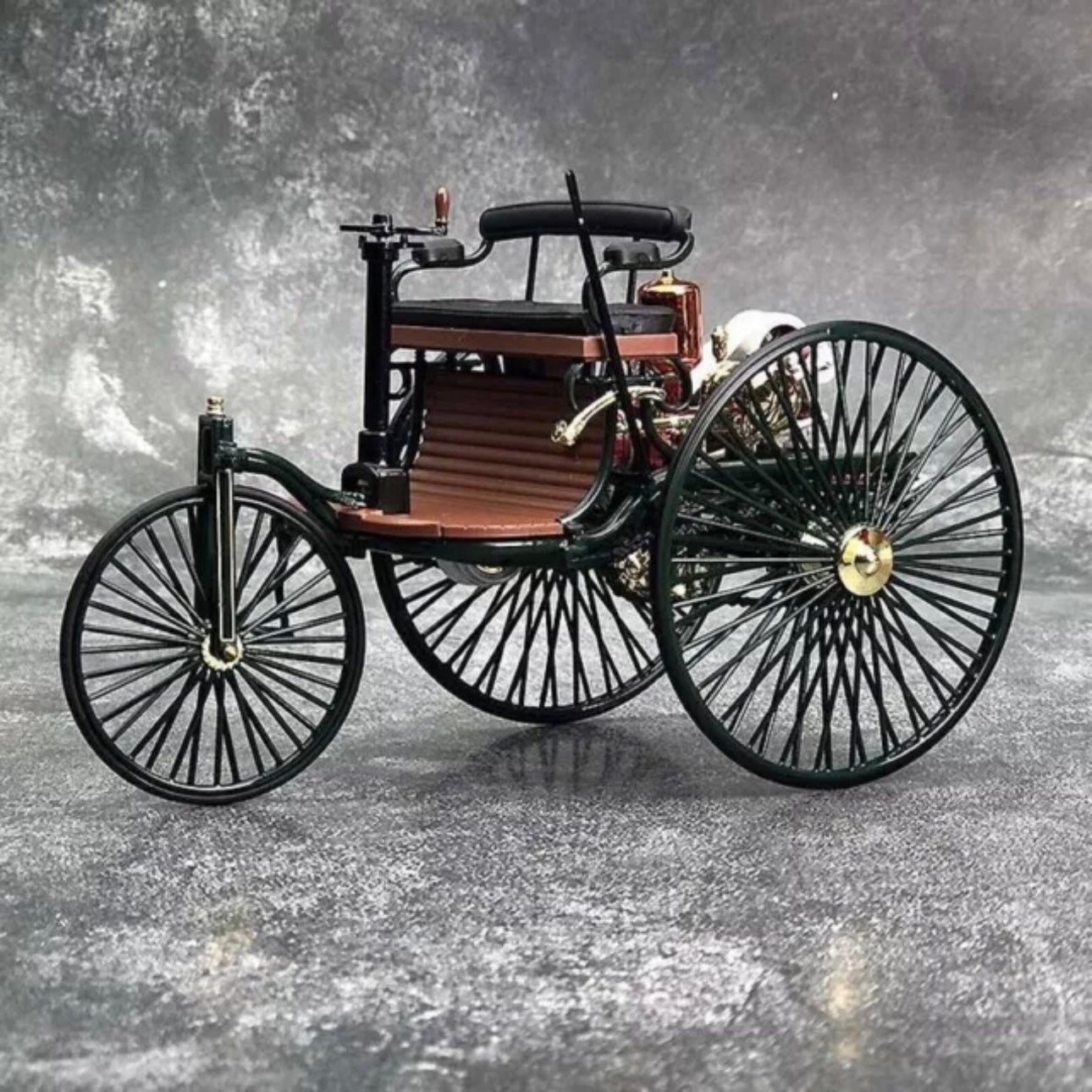 A diecast scale replica model of an 1886 Benz Patent Motorwagen car