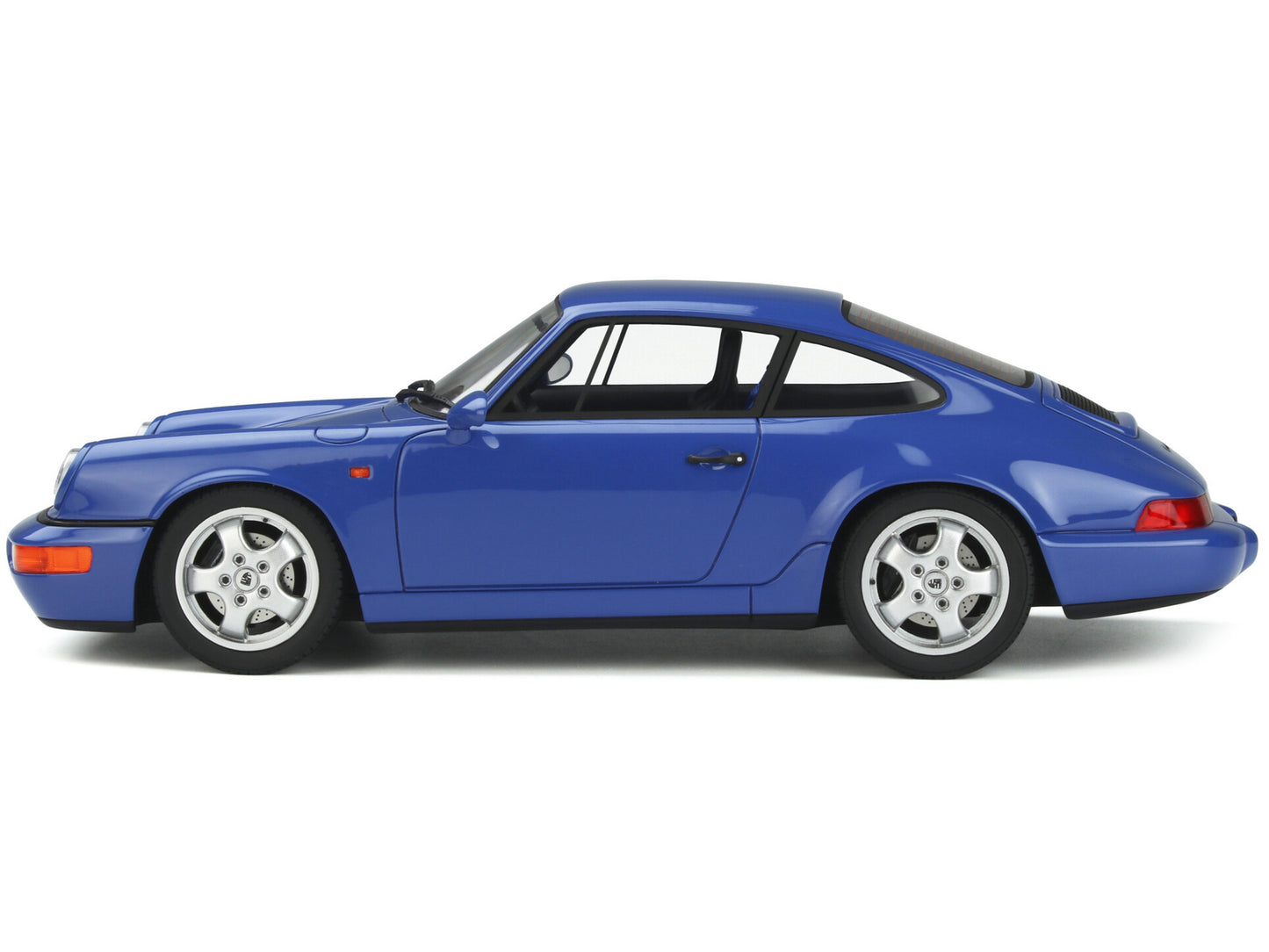 Brand new 1/18 scale car model of 1992 Porsche 964 RS Blue model car by GT Spirit.
Brand new box.
Real rubber tires.
