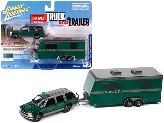 Brand new 1/64 scale diecast car model of 1997 Chevrolet Tahoe Central County Sheriff Emerald Green and Gray with SWAT Camper Trailer Limite